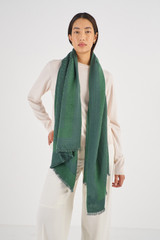 Profile view of model wearing the Oroton Hannah Wrap Scarf in Juniper and  for Women