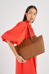 Profile view of model wearing the Oroton Iris Medium Day Bag in Cinnamon and Pebble Leather for Women