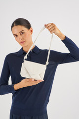 Profile view of model wearing the Oroton Elvie Crossbody in Clotted Cream and Smooth leather for Women