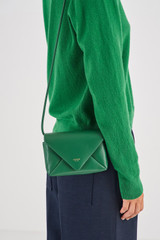 Profile view of model wearing the Oroton Elvie Crossbody in Treehouse and Smooth leather for Women