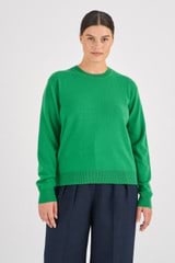 Profile view of model wearing the Oroton Long Sleeve Cashmere Crew Knit in Jewel Green and 100% Cashmere for Women