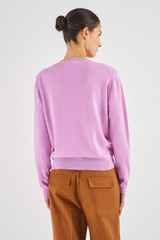 Profile view of model wearing the Oroton Long Sleeve Cashmere Crew Knit in Lilac and 100% Cashmere for Women
