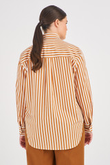Profile view of model wearing the Oroton Long Sleeve Stripe Shirt in Treacle and 100% Cotton for Women