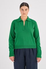 Profile view of model wearing the Oroton Merino Relaxed Polo in Juniper Green and 100% Merino Wool for Women