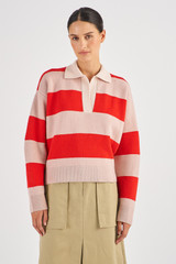 Profile view of model wearing the Oroton Merino Stripe Rugby Knit in Poppy/Peach and 100% Merino Wool for Women