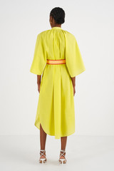 Profile view of model wearing the Oroton Contrast Belt Dress in Honey Dew and 100% Cotton for Women