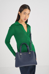 Profile view of model wearing the Oroton Anika Small Day Bag in Dark Navy and  for Women