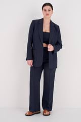 Profile view of model wearing the Oroton Pintuck Pant in North Sea and 58% Viscose, 42% Linen for Women