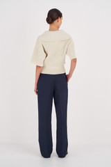 Profile view of model wearing the Oroton Pintuck Pant in North Sea and 58% Viscose, 42% Linen for Women