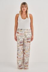Profile view of model wearing the Oroton Label Print PJ Pant in Soft Cream and 100% Silk for Women
