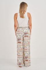 Profile view of model wearing the Oroton Label Print PJ Pant in Soft Cream and 100% Silk for Women