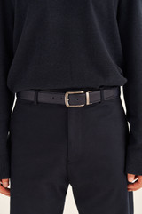 Profile view of model wearing the Oroton Bradford Reversible Belt in Black/Ink and Veg Leather for Men