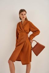 Profile view of model wearing the Oroton Robe Dress in Tan and 75% Viscose 25% Polyester for Women