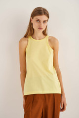Profile view of model wearing the Oroton Jersey Tank in Lemon Zest and 100% Cotton for Women