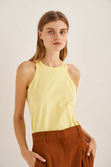 Profile view of model wearing the Oroton Jersey Tank in Lemon Zest and 100% Cotton for Women