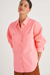 Profile view of model wearing the Oroton Drill Overshirt in Sherbet and Cotton Drill for Women