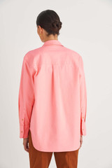 Profile view of model wearing the Oroton Drill Overshirt in Sherbet and Cotton Drill for Women
