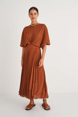 Profile view of model wearing the Oroton Pleated Dress in Cognac and 100% Polyester for Women