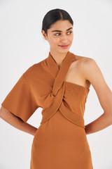 Profile view of model wearing the Oroton Asymmetric Dress in Toffee and 77% Viscose 23% Polyester for Women