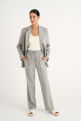 Profile view of model wearing the Oroton Jogger Pant in Grey Marle and 95% Wool 5% Elastane for Women