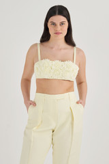 Profile view of model wearing the Oroton Lace Poppy Bandeau in Lemon Butter and 100% Linen for Women