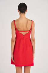 Profile view of model wearing the Oroton Short Scallop Dress in True Red and 100% Cotton for Women