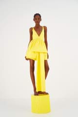 Profile view of model wearing the Oroton Silk Mini Sundress in Vibrant Yellow and 100% Silk for Women