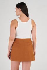 Profile view of model wearing the Oroton Contrast Bind Wrap Skirt in Brandy and 100% Linen for Women