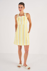 Profile view of model wearing the Oroton Stripe Apron Dress in Marigold and 100% Linen for Women