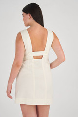 Profile view of model wearing the Oroton Button Up Mini Dress in Soft Cream and 100% Linen for Women
