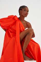 Profile view of model wearing the Oroton One Shoulder Dress in True Red and 100% Cotton for Women