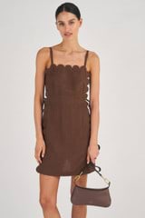 Profile view of model wearing the Oroton Mini Scallop Dress in Dark Chocolate and 100% Linen for Women