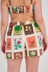 Profile view of model wearing the Oroton Flower Stamp Print Short in String and 100% Linen for Women
