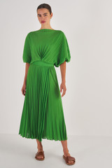 Profile view of model wearing the Oroton Pleated Dress in Garden and 100% Polyester for Women