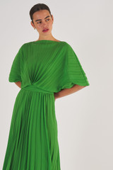Profile view of model wearing the Oroton Pleated Dress in Garden and 100% Polyester for Women