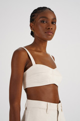 Profile view of model wearing the Oroton Denim Bralette in Cream and 100% Cotton for Women