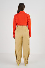 Profile view of model wearing the Oroton Zip Detail Pant in Wheat and 77% Cotton 23% Linen for Women