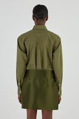 Profile view of model wearing the Oroton Poplin Long Sleeve Shirt in Khaki and 100% Cotton for Women