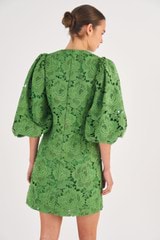 Profile view of model wearing the Oroton Short Lace Dress in Garden and 100% Polyester for Women