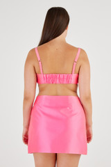 Profile view of model wearing the Oroton Satin Bralette in Candy Pink and 85% Polyester, 15% Silk for Women