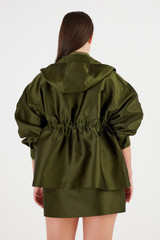 Profile view of model wearing the Oroton Satin Parka in Khaki and 85% Polyester, 15% Silk for Women