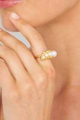 Profile view of model wearing the Oroton Lexie Ring in Worn Gold/Pearl and  for Women