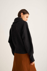 Profile view of model wearing the Oroton Rib Collar Knit in Dark Charcoal and 100% Wool for Women