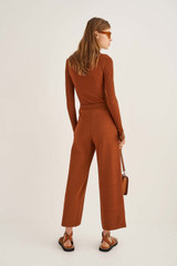 Profile view of model wearing the Oroton Knit Pant in Cognac and 83% Viscose 17% Polyester for Women