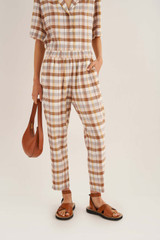Profile view of model wearing the Oroton Check Pant in Cocoa and 70% Viscose 30% Acetate for Women