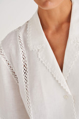 Profile view of model wearing the Oroton Crochet Trim Shirt in Antique White and 100% Linen for Women