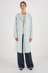 Profile view of model wearing the Oroton Double Face Wool Overcoat in Blue and 50% Wool 50% Polyester for Women