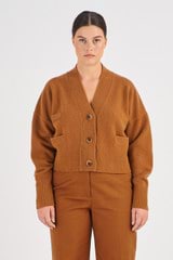 Profile view of model wearing the Oroton Merino Boxy Cardigan in Wicker and 100% Merino Wool for Women