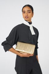 Profile view of model wearing the Oroton Fay Medium Chain Crossbody in Gold and Metallic Pebble Leather for Women