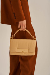 Profile view of model wearing the Oroton Heath Day Bag in Mango and Smooth Leather for Women